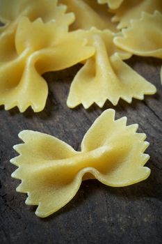 close up of Italian raw pasta on wood