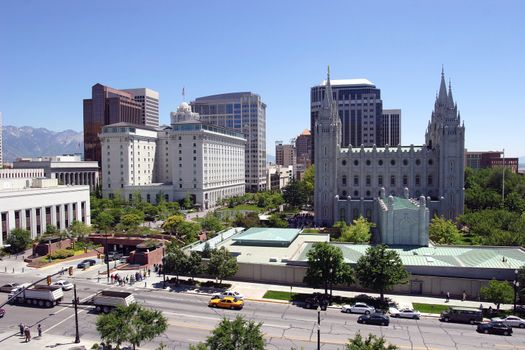 A scene of downtown Salt Lake city in Utah. The Mormon church tabernacle is seen in the foreground.