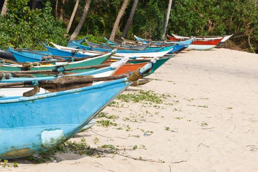 Fishing boats on beach. Mirissa, Sri Lanka