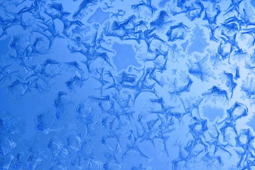 Frost patterns on window glass in winter