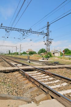 Railroad and pedestrian crossing. Against the background of blue sky.