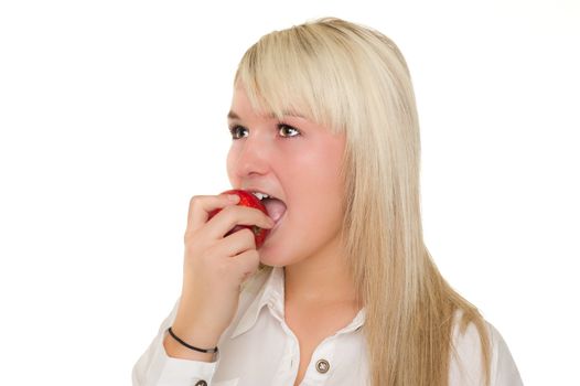 Young girl eating an apple over white background