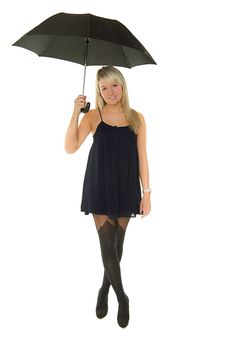 Young beautiful girl in blue dress holds a umbrella