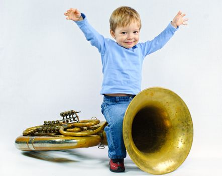 Little musician. Little cute boy and tuba