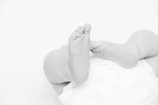 foot of newborn baby as close up