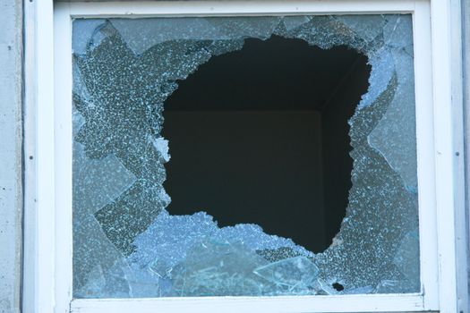 Broken Window with very sharp glass fragments