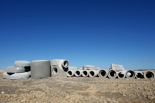 concrete pipes on a building site on a sunny day