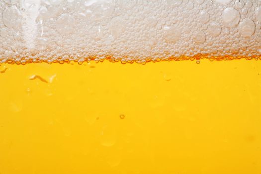 Detail of a beer in a glass with foam