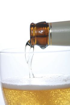 Detail of a beer in a glass with foam