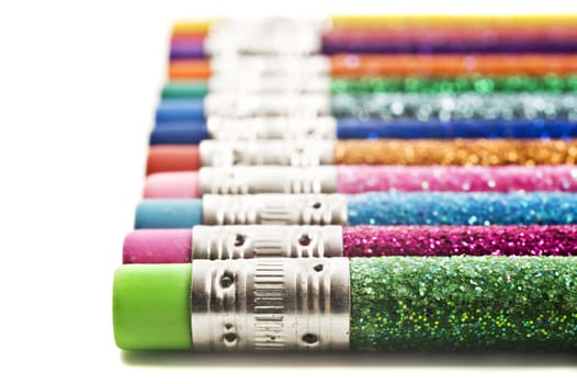 Colorful pencils with erasers covered in glitter