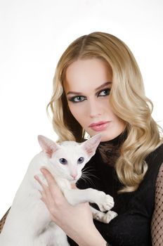 beauty young blond woman with oriental shorthair cat on a white