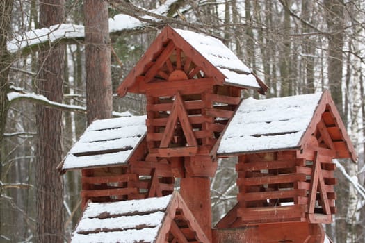 Close up of a bird house in a park.