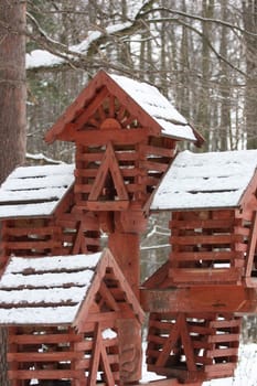 Close up of a bird house in a park.