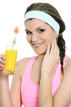 beautiful woman is drinking a fresh orange juice
