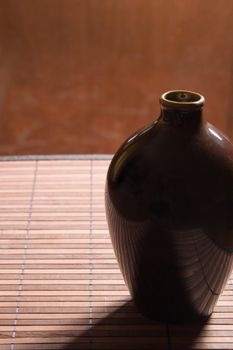 Pretty ceramic jug on a bamboo napkin