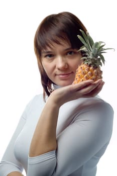 Beautiful girl with pineapple, white blouse, isolated