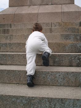 toddler moving up staircase