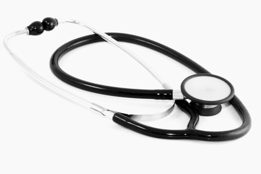 a black clinical stethoscope on the white background