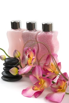Spa salts, lotion, orchid, and healing stones