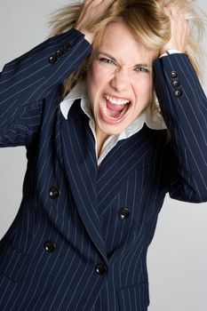 Beautiful frustrated angry businesswoman yellling