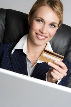 Smiling woman holding credit card