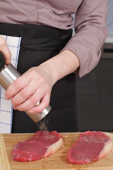 a rare rump steak is getting prepared