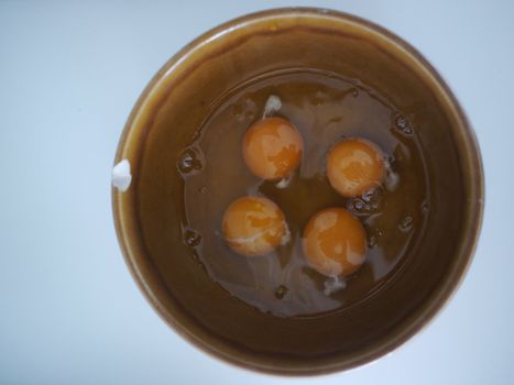 eggs in a bowl on a wooden background