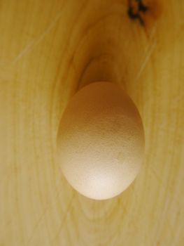 brown eggs on a wooden surface indoor