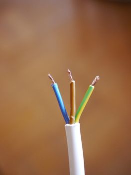 Electrical cables wires isolated on brown background