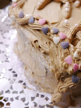 a close-up of a  chocolate valentine cake with hearts