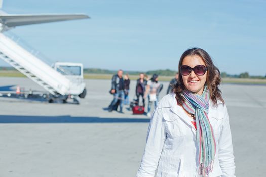 Smile beautiful woman tourist prepared to fly