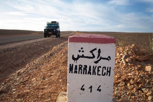 Road Sign to Marrakech in Morocco with blue sky
