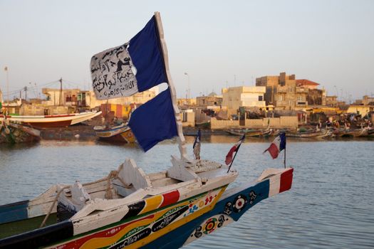 Flags on a fisher boat in the harbour of Saint Louis in Senegal