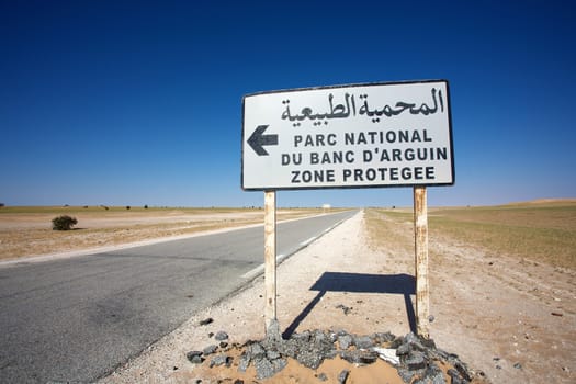 Sign road indicating the direction to the Banc d'Arguin National Wildlife Park in Mauritania