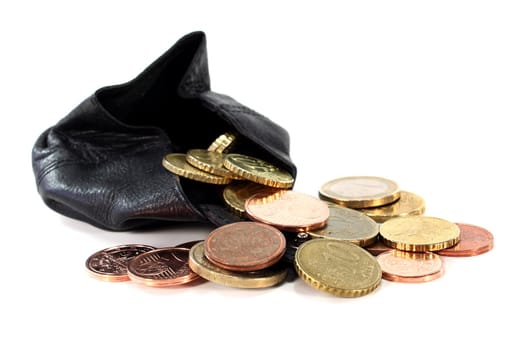 a black purse filled with euro coins
