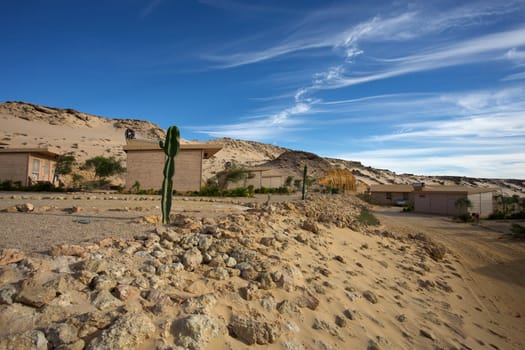 Coast of Southern Morocco with the Atlantic Ocean and a few bungalows with the desert all around