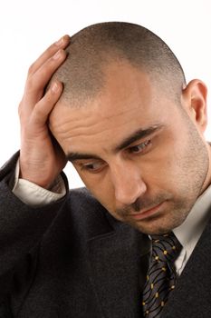 Portrait of businessman with a  headache  over white