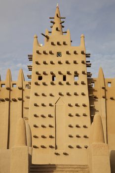 The big mosque in Djenné  and the traditional mud building in Mali. 