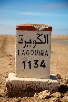 Road Sign to Lagouira in Morocco with blue sky