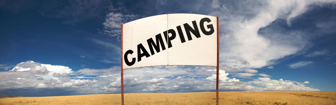 Camping signboard in the de desert of Namibia