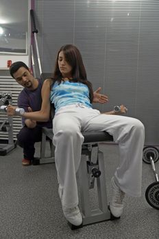 Woman practices and resting in Gym