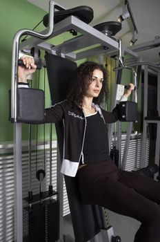 Woman practices and resting in Gym