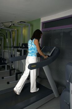 Woman practices and resting in Gym