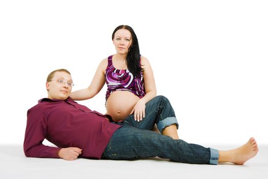 happy young couple on a white background. Pregnancy
