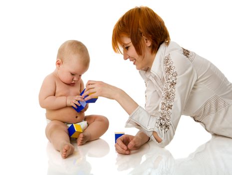 Mother playing with baby girl sitting isolated on white