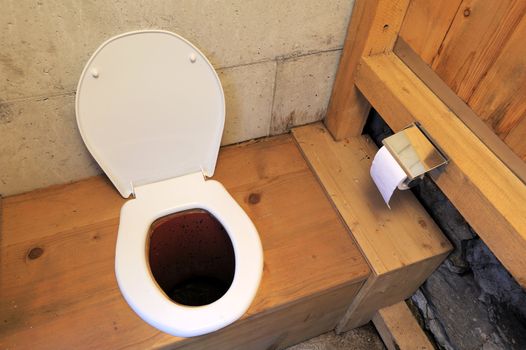 View of the interior of a longdrop toilet in the Swiss alps.