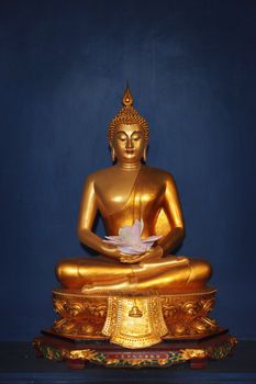 Buddha image from Thailand on dark background photo