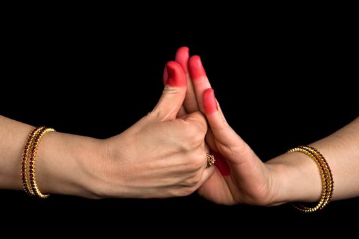 Woman hands showing Shankhu hasta of indian classic dance Bharata Natyam