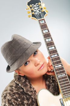 Young beautiful country music guitar girl smiling