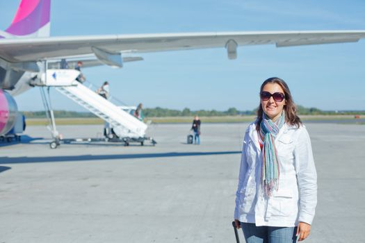 Smile beautiful woman tourist prepared to fly